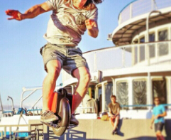 Riding an Airwheel electric-self-balancing scooter will become a fresh traveling tool for beach tourist.